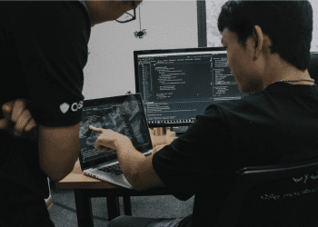 Technical team engaged in coding review sessions, reflecting the impact of enterprise AI platform adoption on enterprise-level solutions.