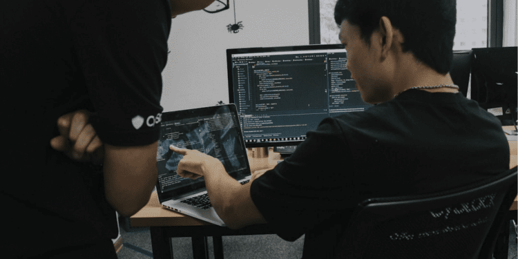 Technical team engaged in coding review sessions, reflecting the impact of enterprise AI platform adoption on enterprise-level solutions.