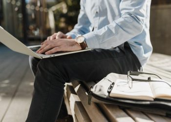 executive using laptop outdoors