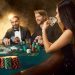 Group of young rich people is playing poker in the casino. Two men in business suits and a young woman in a black dress. Smoke. Casino. Poker