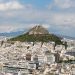 An aerial view of buildings and hills in Athens, Greece