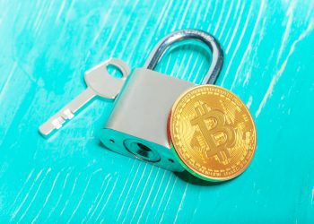 Gold bitcoin and padlock