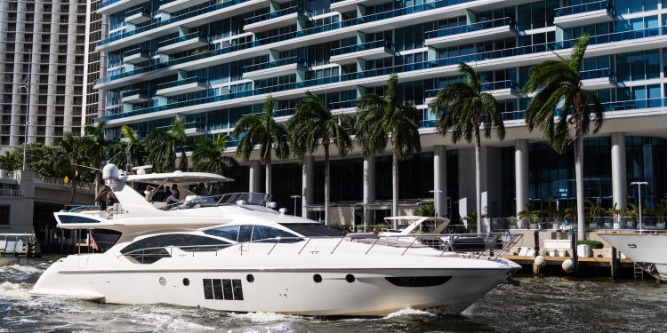 Yachting boat tourism. Luxury lifestyle. Vacation on summer. Yacht at sea. Motorboat yacht sailing at sea. Charter motorboat. Traveling by boat. Luxury boat motor yacht at sea.