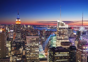 New York City Manhattan skyline aerial view with Empire State Building and Times Square at sunset.