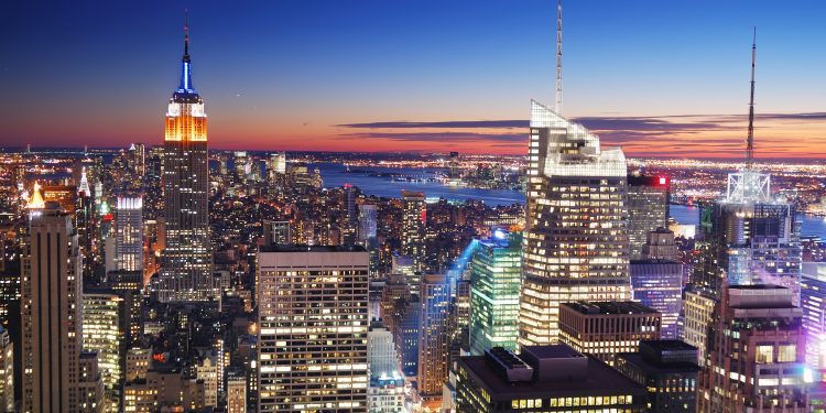 New York City Manhattan skyline aerial view with Empire State Building and Times Square at sunset.