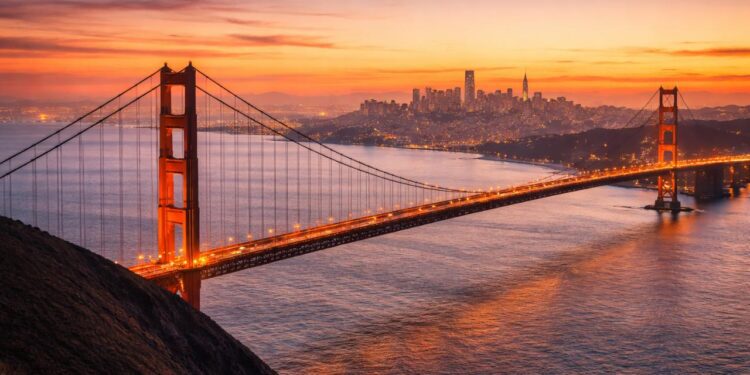 The iconic Golden Gate Bridge and SF skyline viewed from the Marin Headlands at sunset.