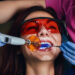 Female dentist treating a patient. Close-up photo of a young woman sitting in the dentist's chair.
