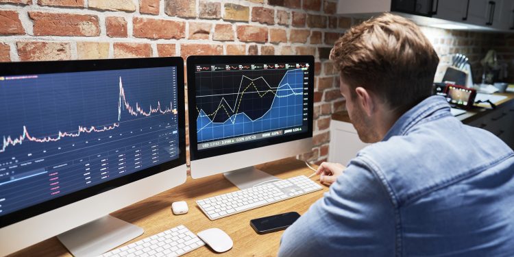 Man following stock market data