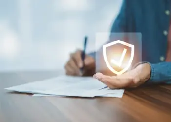 Wealth protection strategy represented by a digital shield icon over financial documents.