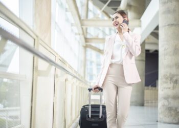 Beautiful business woman is walking in Airport , Business travel concept