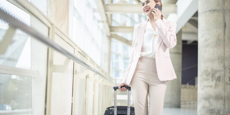 Beautiful business woman is walking in Airport , Business travel concept