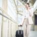Beautiful business woman is walking in Airport , Business travel concept