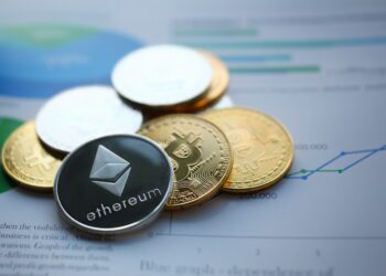 Silver ethereum jn chart paper closeup. Hard fork news consept