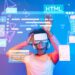 Explore the intersection of virtual reality and coding with this dynamic image showcasing a person engaging with digital languages and software development in an immersive environment. XDMCP