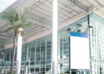 Blank city billboard with copy space for your text message or content buildings in background,selective focus