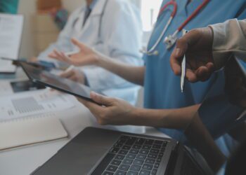 international team of professional doctors having a meeting in conference room at the modern hospital. Healthcare and medical development concept.