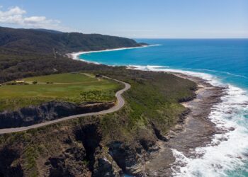 A mesmerizing scenery of a beautiful beach with blue sky in the background in Hong Kong