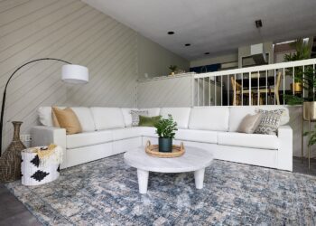 Modern white living room with plants.