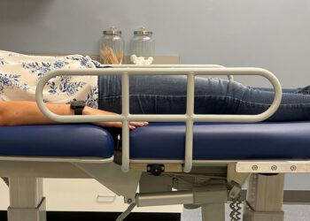 Patient on chiropractic treatment table.