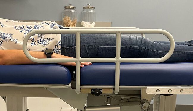 Patient on chiropractic treatment table.