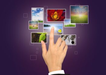 Business Hand touches the flow of images