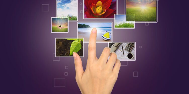 Business Hand touches the flow of images