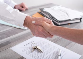 Handshake between estate agent and customer