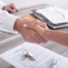 Handshake between estate agent and customer