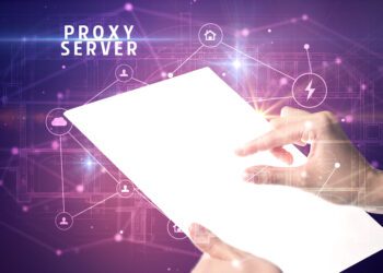 Holding futuristic tablet with PROXY SERVER inscription, cyber security concept