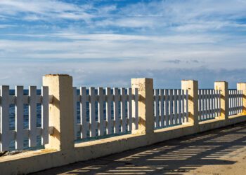 An old embankment along the seashore, a sky with wisps of cloud, a natural concept awaiting the winter storm season
