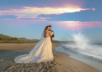 IZMIR, TURKEY - Jul 08, 2017: Young bride and groom in wedding dress, as well as casual wedding dress outdoors.