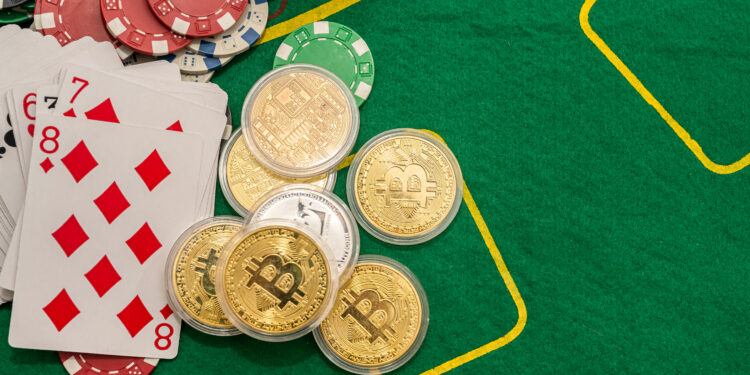 Poker new cards with various chips and money are laid out on a green playing poker table. Poker concept. Game concept
