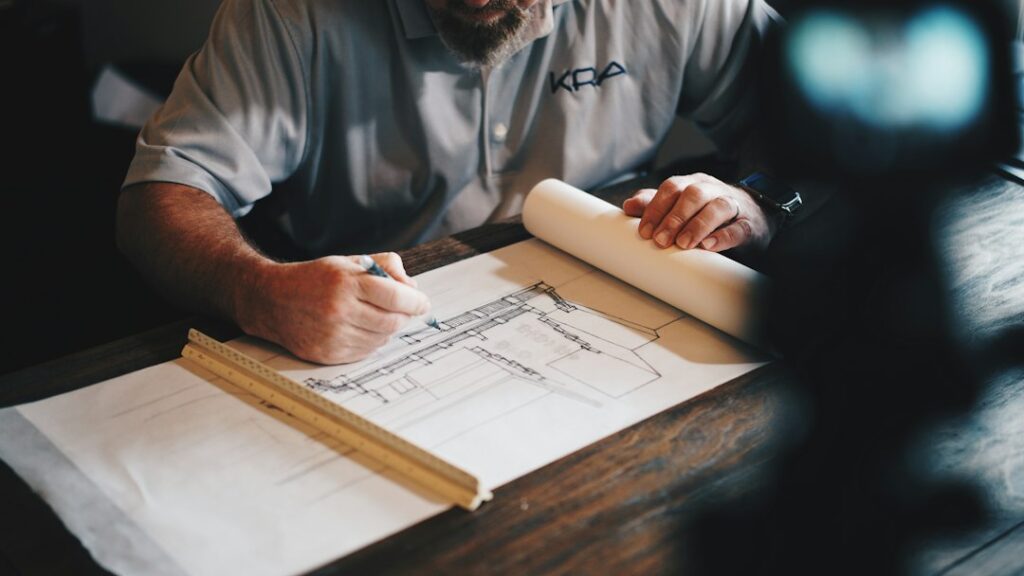 Architect working with plans at a desk; illustrative image for foundation report guide