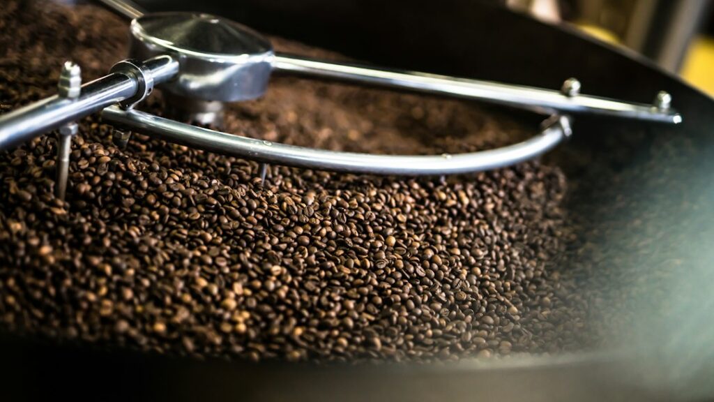 Illustrative coffee production scene; this image does not depict Evan Hafer