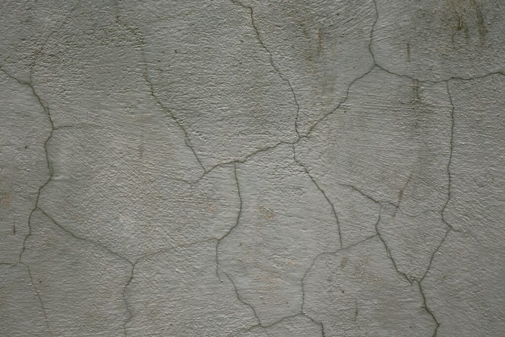 Cracked wall photographed by Vladislav Nikonov; illustrative image, not a diagnosed foundation crack
