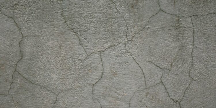 Cracked wall photographed by Vladislav Nikonov; illustrative image, not a diagnosed foundation crack