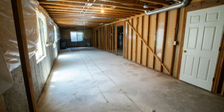 Unfinished basement interior, illustrative image by Real Twin Photos; no visible flood damage