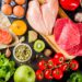 Healthy diet food. Various low fodmap ingredients selection - meat, vegetables, berry, fruit, grains, Trendy healthy lifestyle concept. On dark rusty background copy space top view