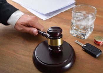 Judge sentencing in a car accident trial due to excessive alcohol consumption. Elevated view.
.
.