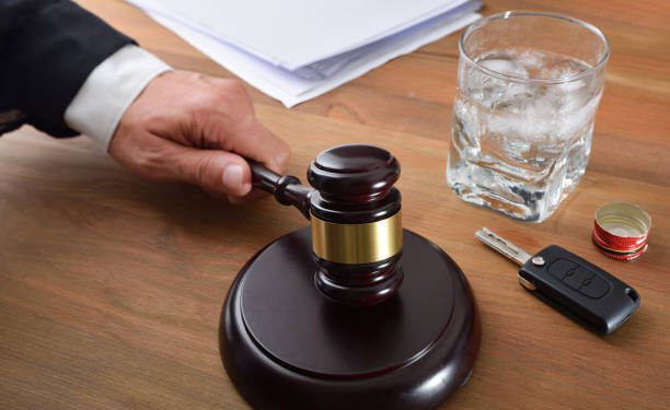 Judge sentencing in a car accident trial due to excessive alcohol consumption. Elevated view.
.
.