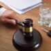 Judge sentencing in a car accident trial due to excessive alcohol consumption. Elevated view.
.
.