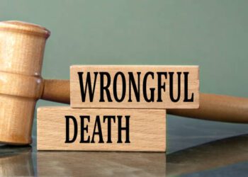 WRONGFUL DEATH - words on wooden blocks with a judge's gavel in the background