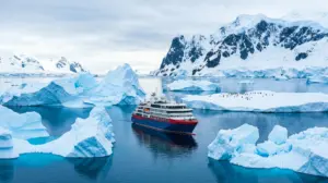 Expedition ship sailing among icebergs in Antarctica